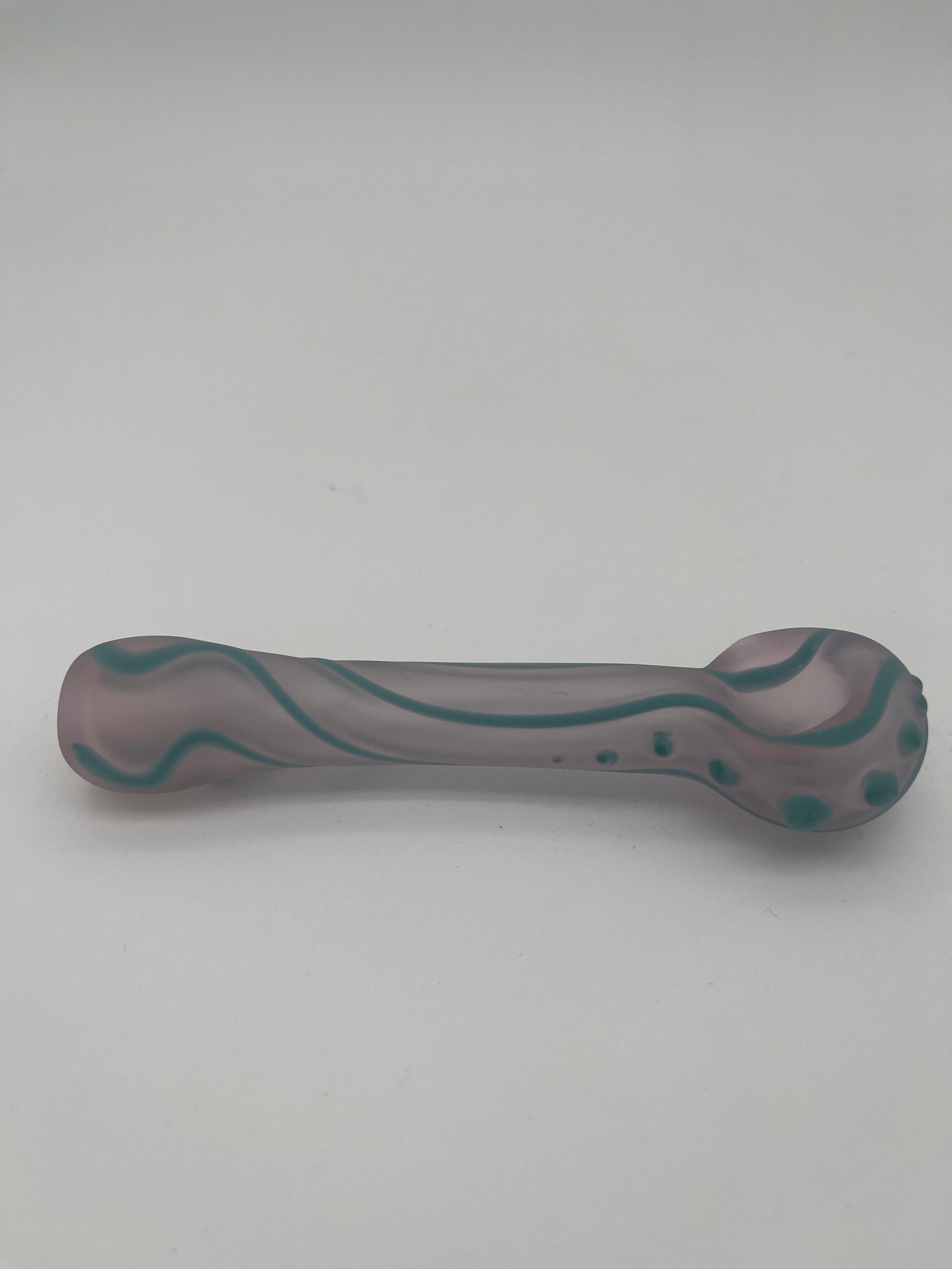 Glass pipe with wavy pattern on a white background
