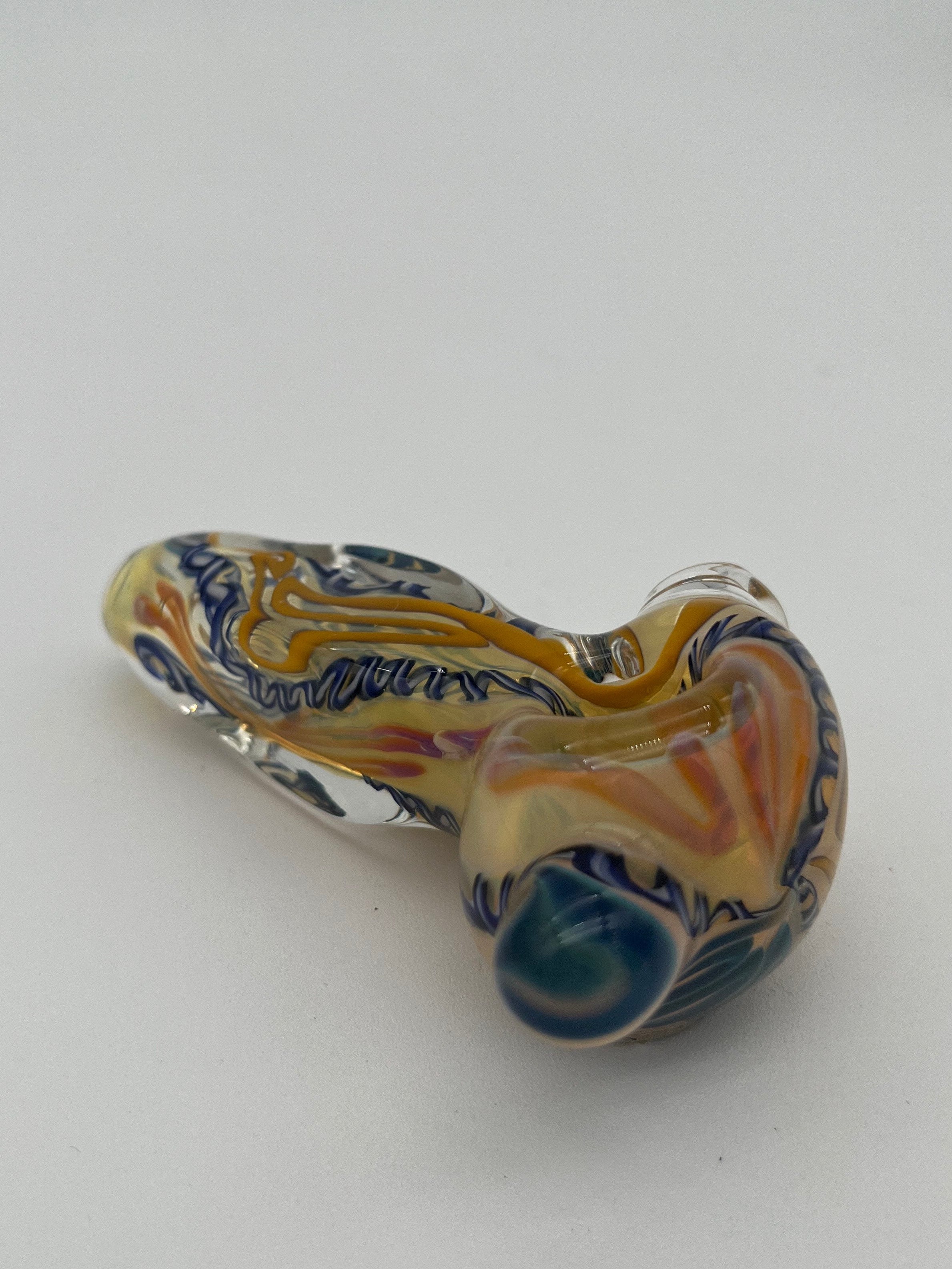 Blue and yellow inside out spiral glass hand pipe made by Nelson Glassworks on a white background. 
