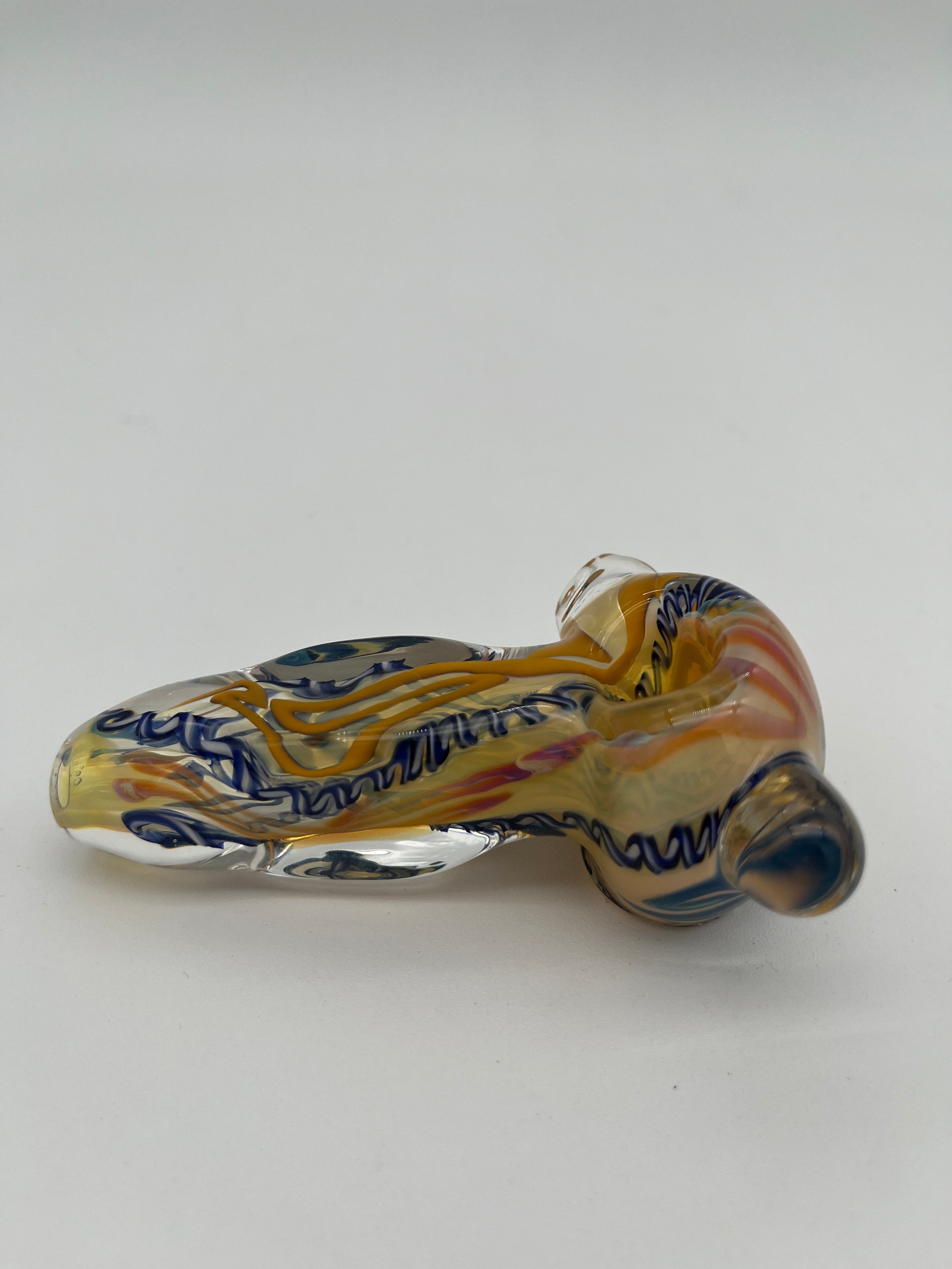 Blue and yellow inside out spiral glass hand pipe made by Nelson Glassworks on a white background. 