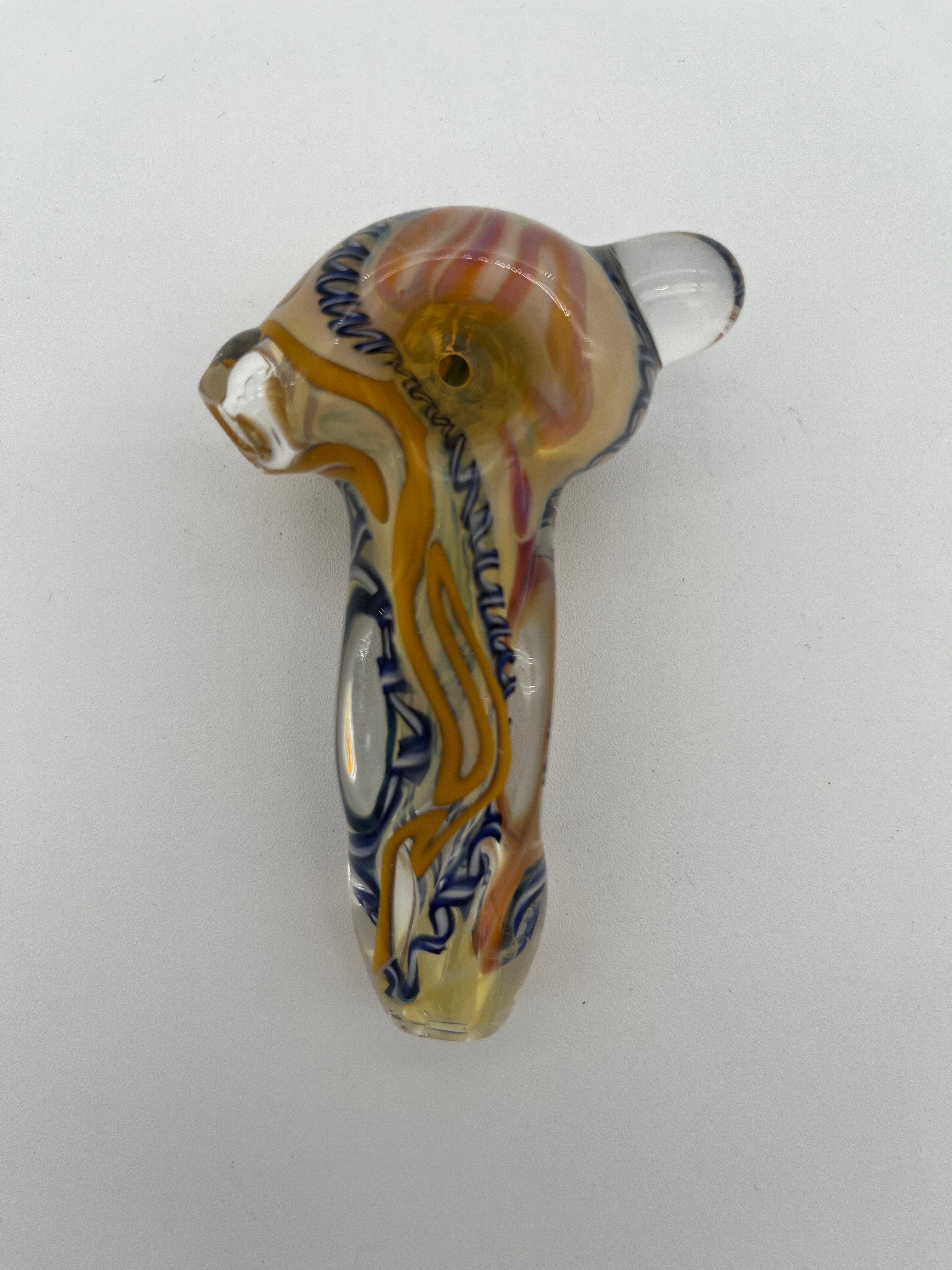 Blue and yellow inside out spiral glass hand pipe made by Nelson Glassworks on a white background. 