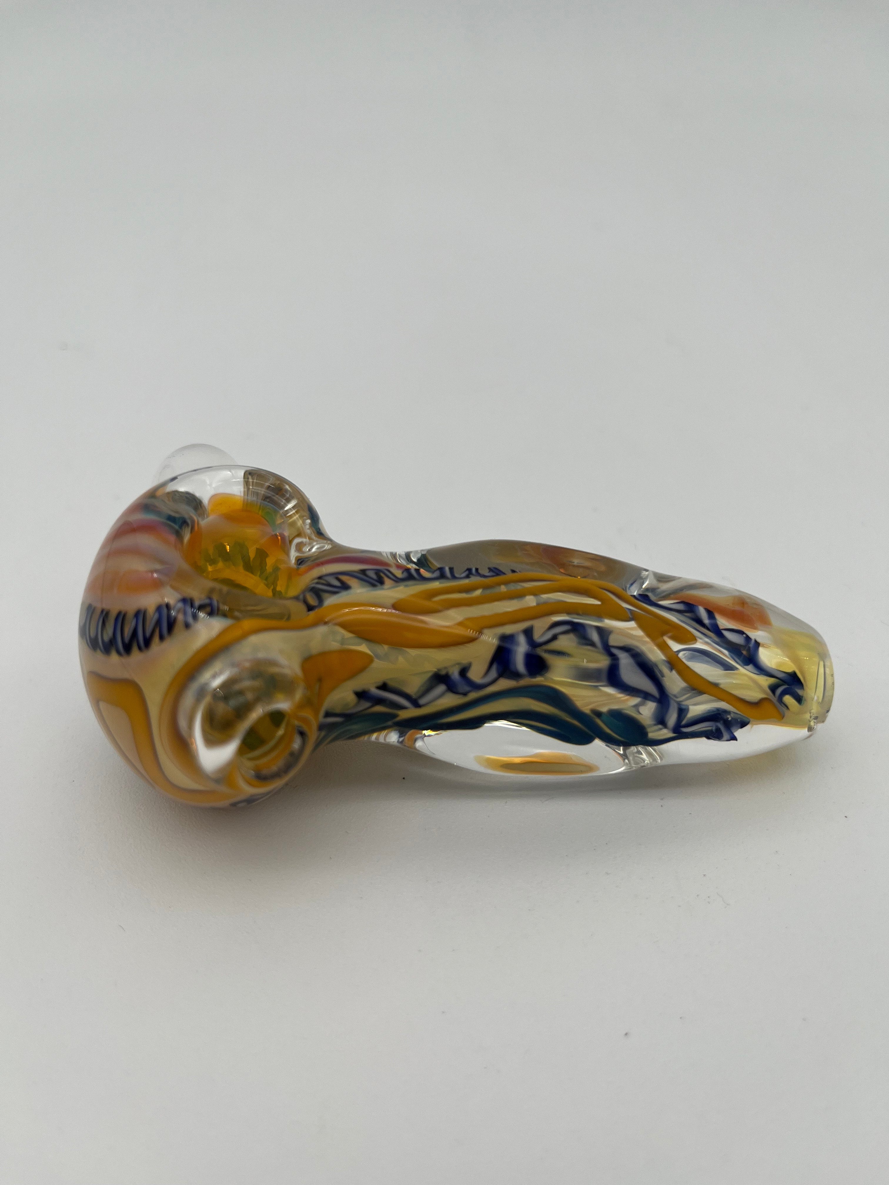 Blue and yellow inside out spiral glass hand pipe made by Nelson Glassworks on a white background. 