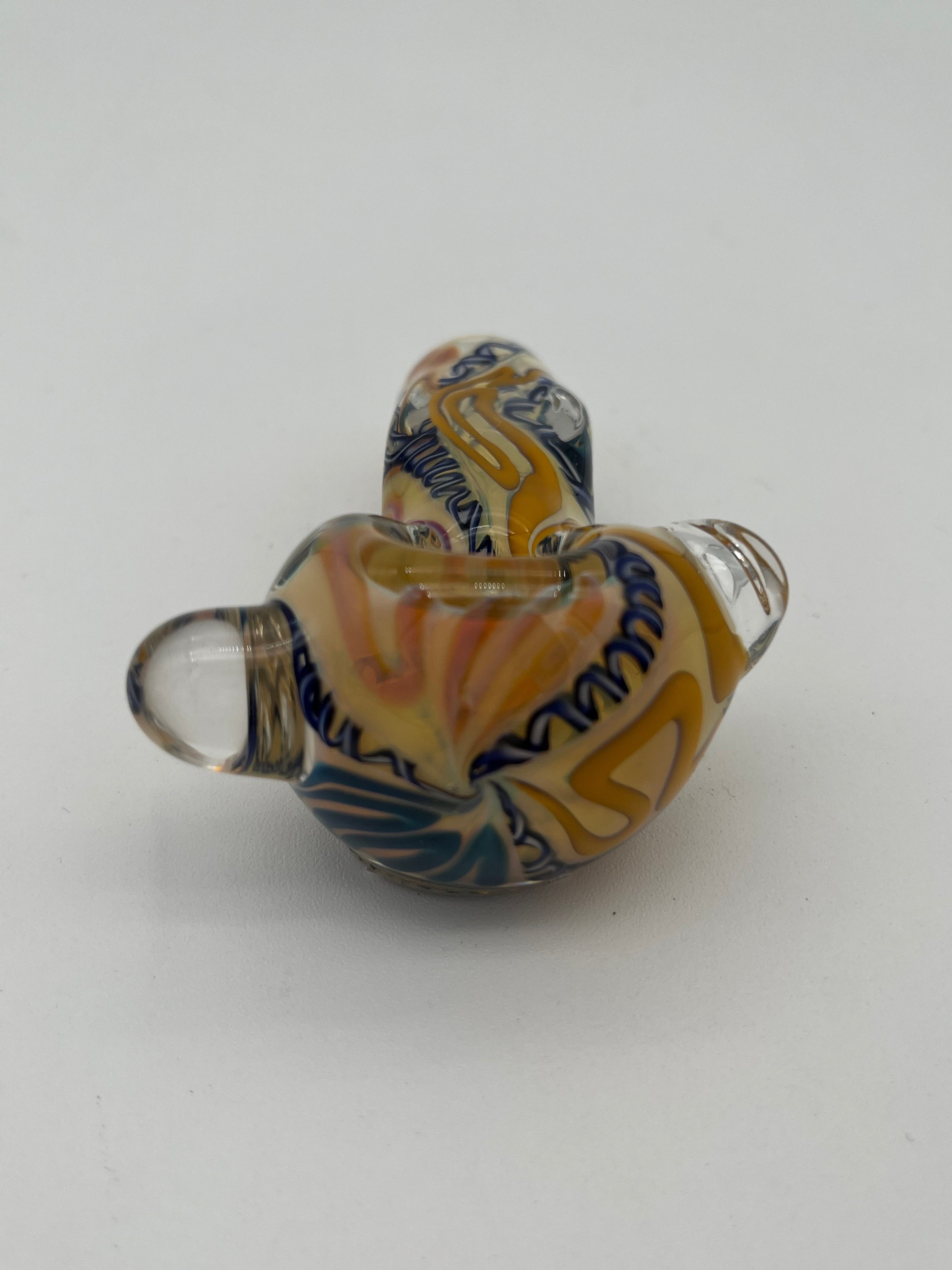 Blue and yellow inside out spiral glass hand pipe made by Nelson Glassworks on a white background. 