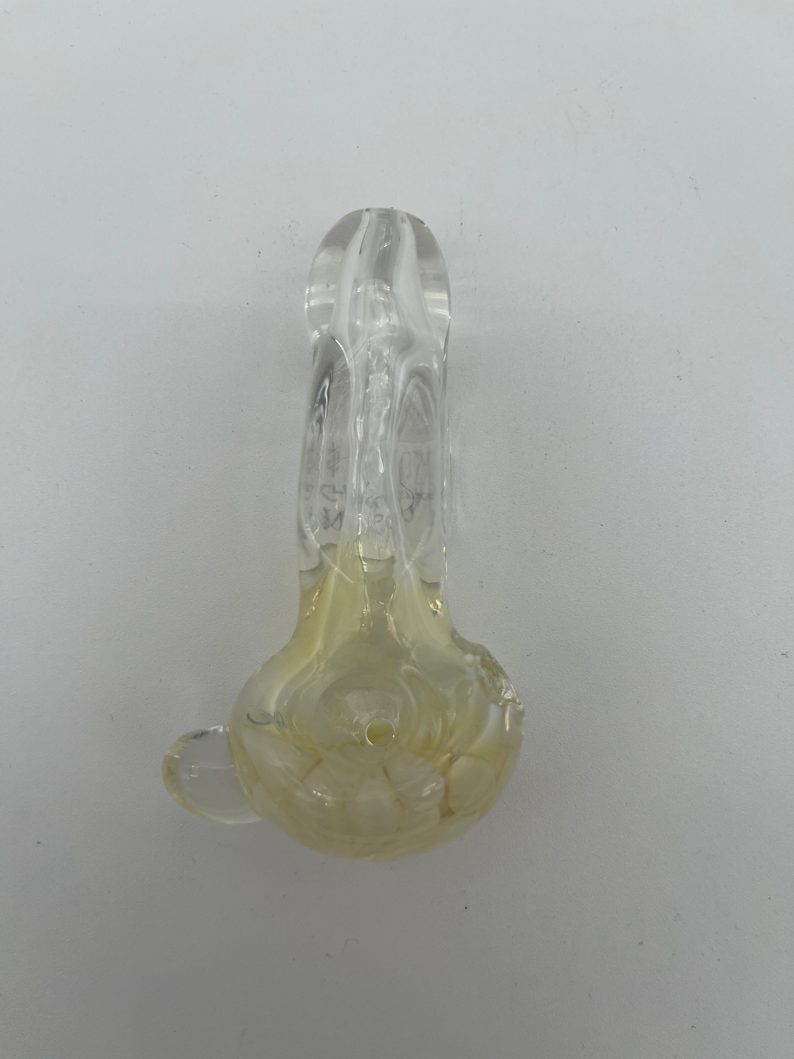 Clear and white floral looking glass pipe made by Nelson Glassworks on a white background.