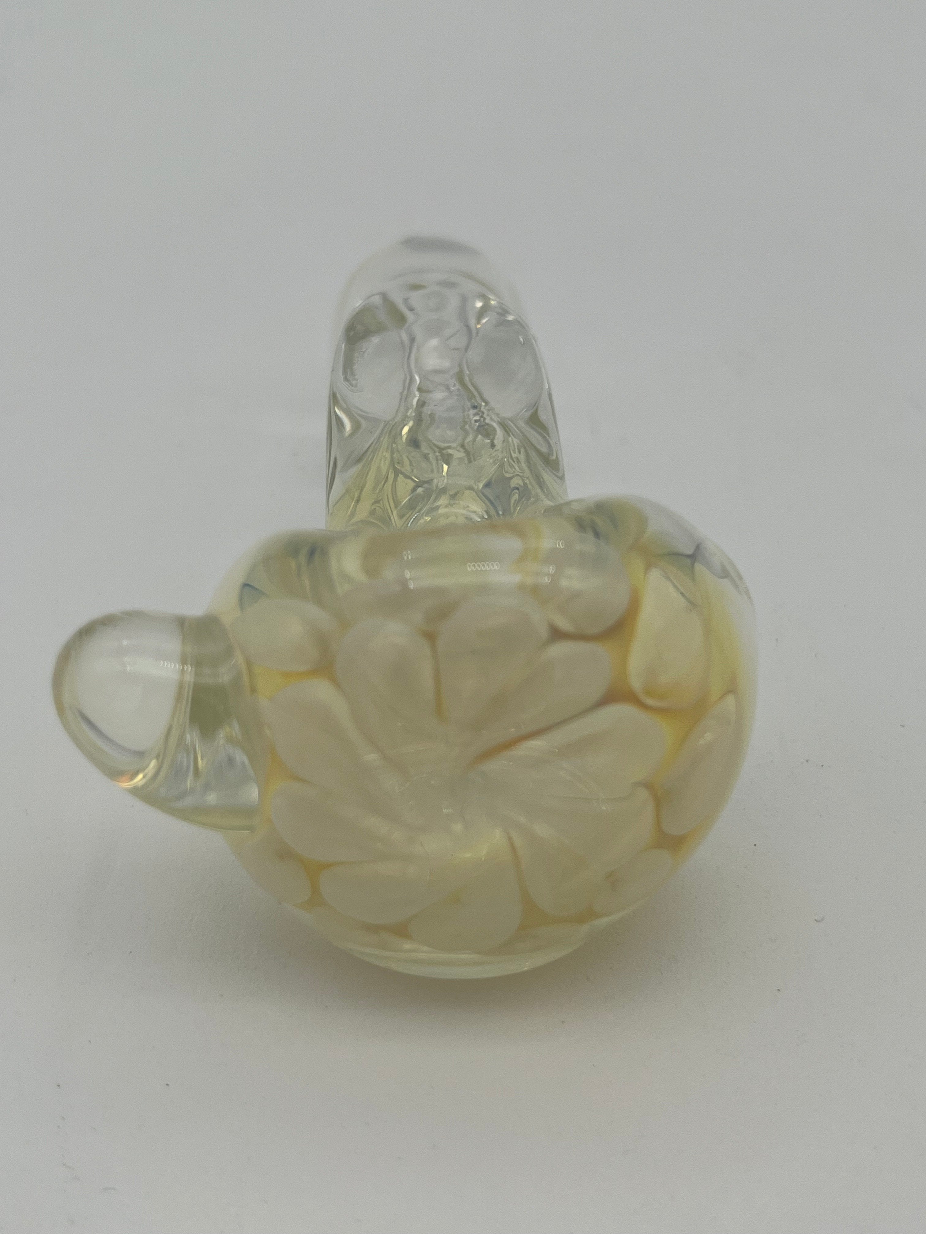 Clear and white floral looking glass pipe made by Nelson Glassworks on a white background.