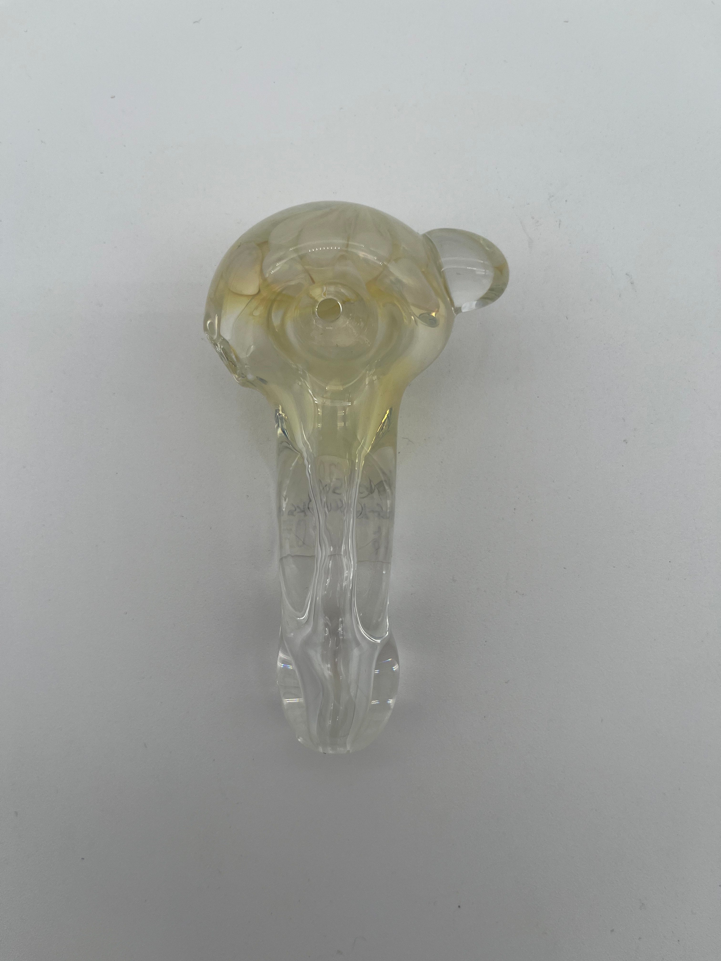 Clear and white floral looking glass pipe made by Nelson Glassworks on a white background.