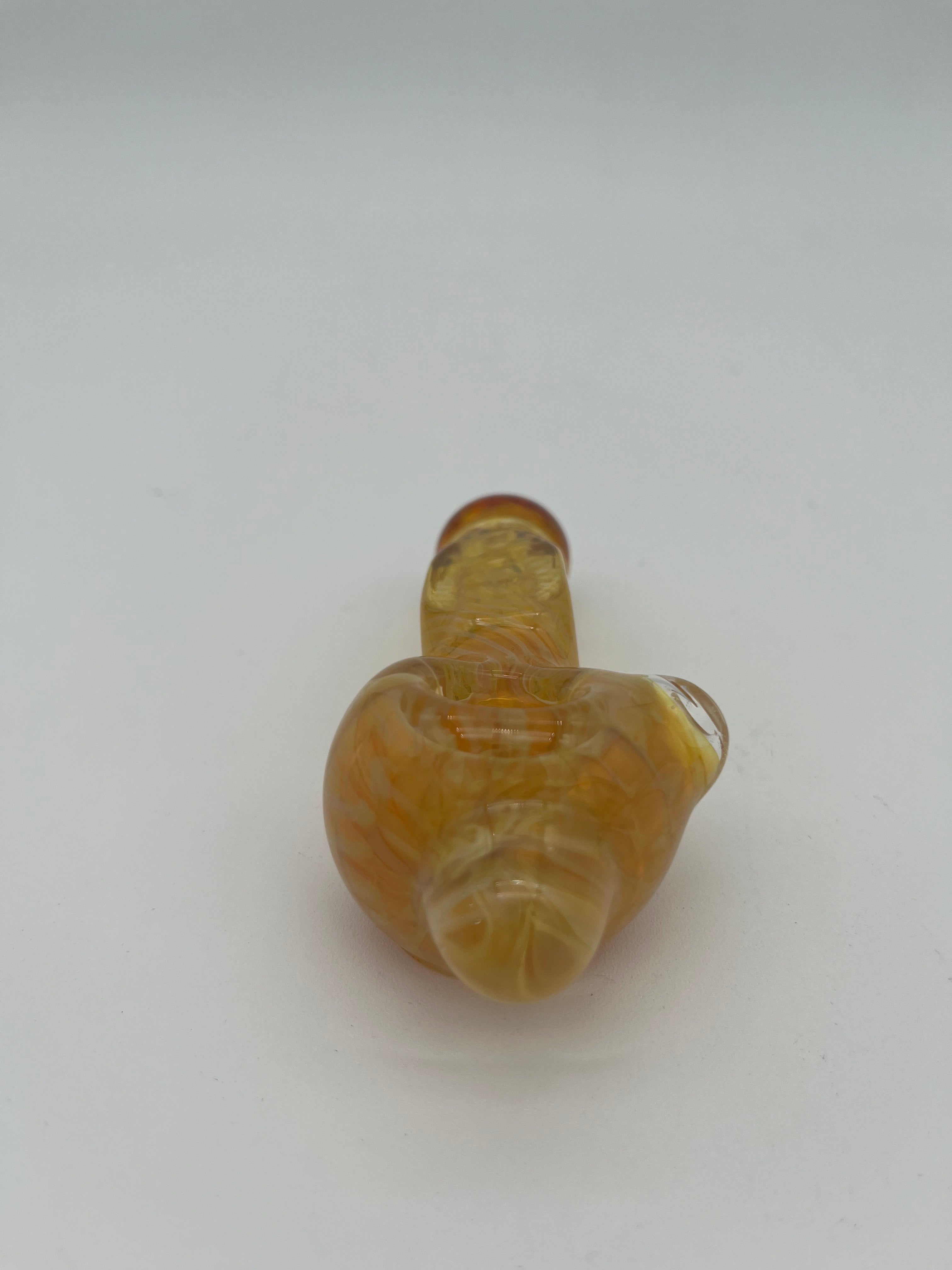 Yellow inside out spiral glass hand pipe made by Nelson Glassworks on a white background