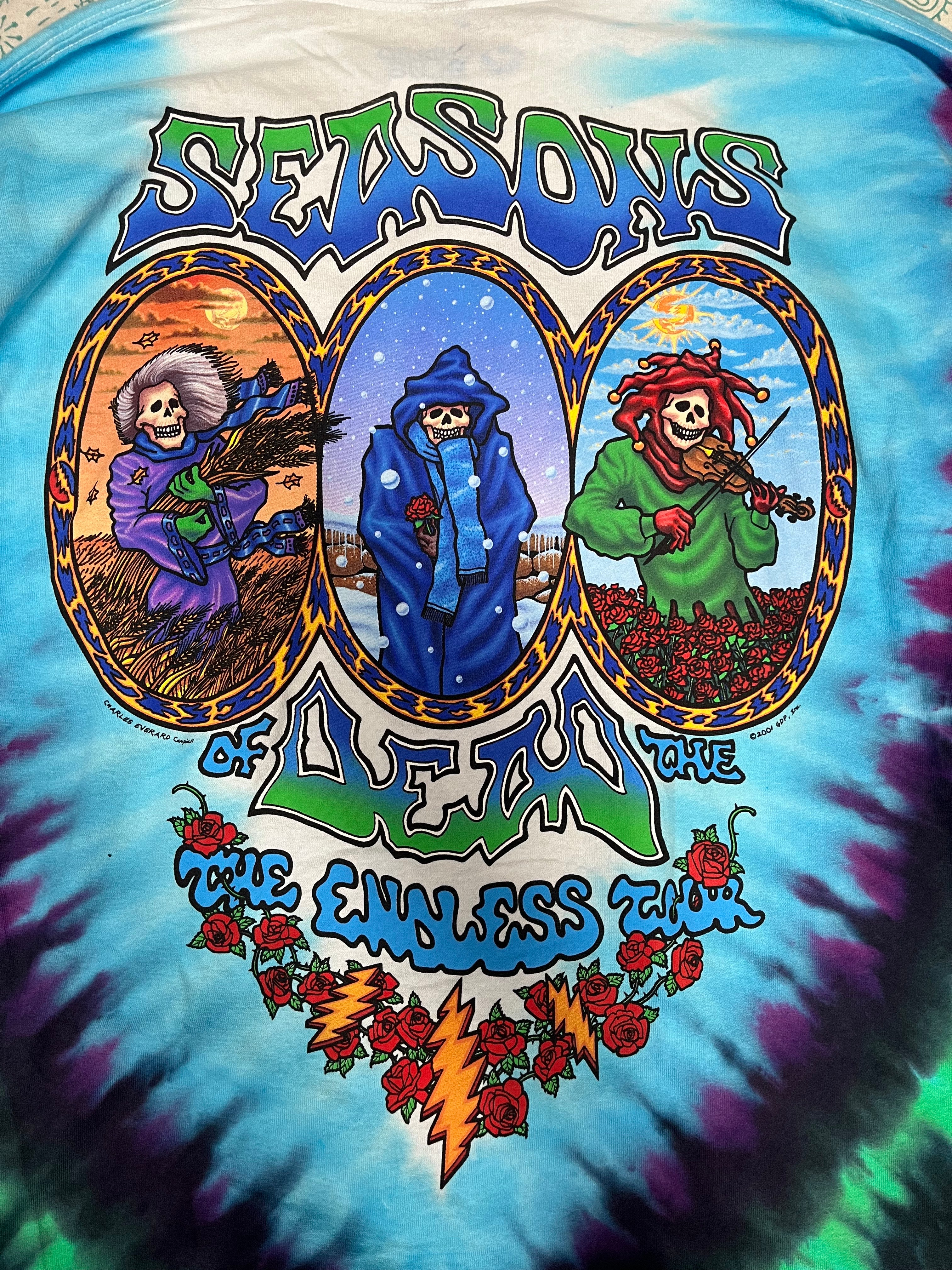 Grateful Dead seasons of the dead tie-dye longsleeve shirt with colorful graphic design featuring characters and text. Back of shirt. The endless tour.